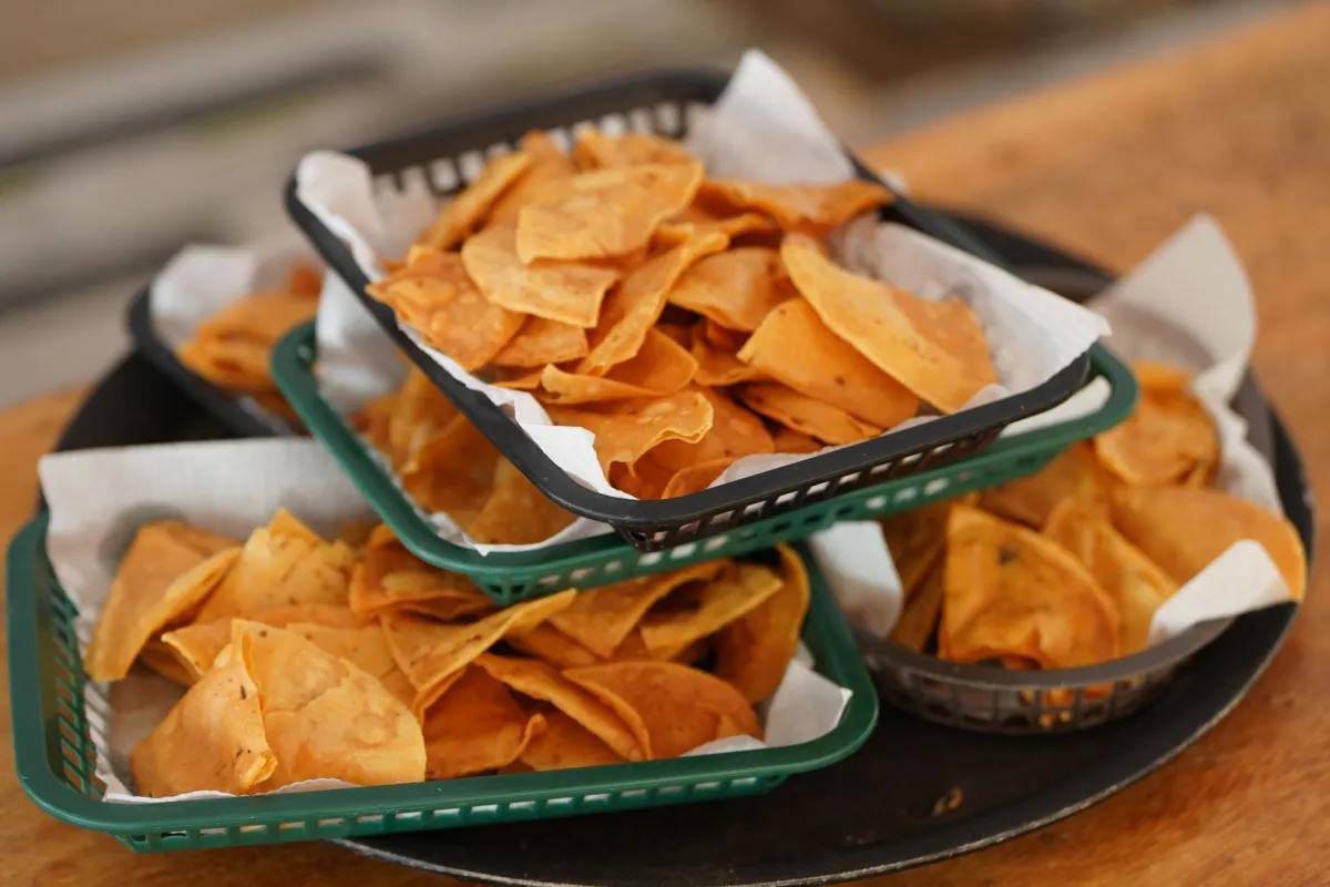 Baskets of fresh-fried tortilla chips ready to serve.